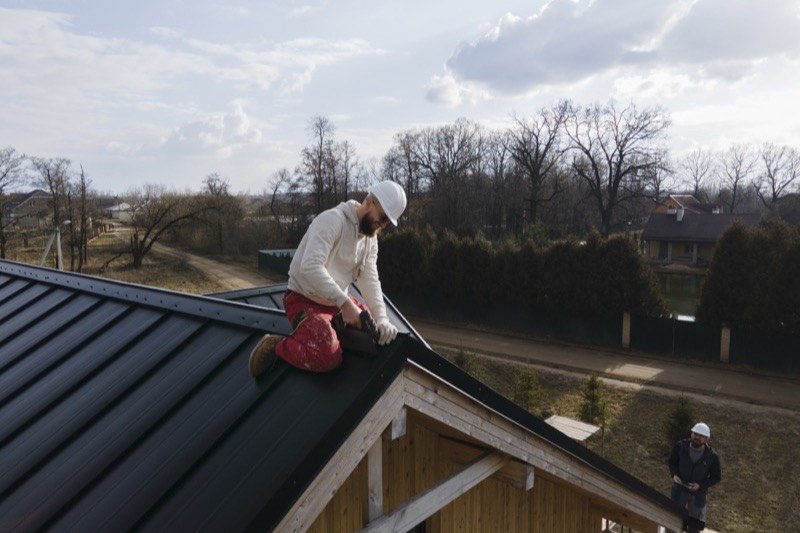 New metal flashing installed at a roof valley