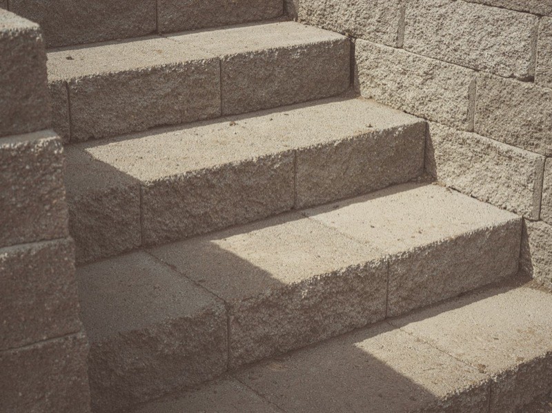 Brick front steps being repaired
